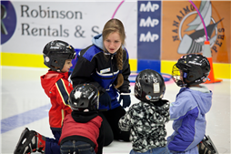 Small groups of children are introduced to skating by highly qualified instructors