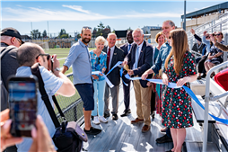 Mayor Leonard Krog cuts the ribbon to officially announce the Stadium District's improvements