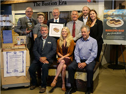 Group photo at presentation with Nanaimo bar stamp