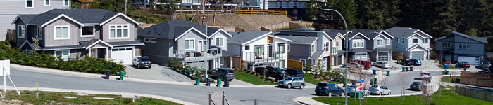 An image looking at a row of modern houses on a Nanaimo street