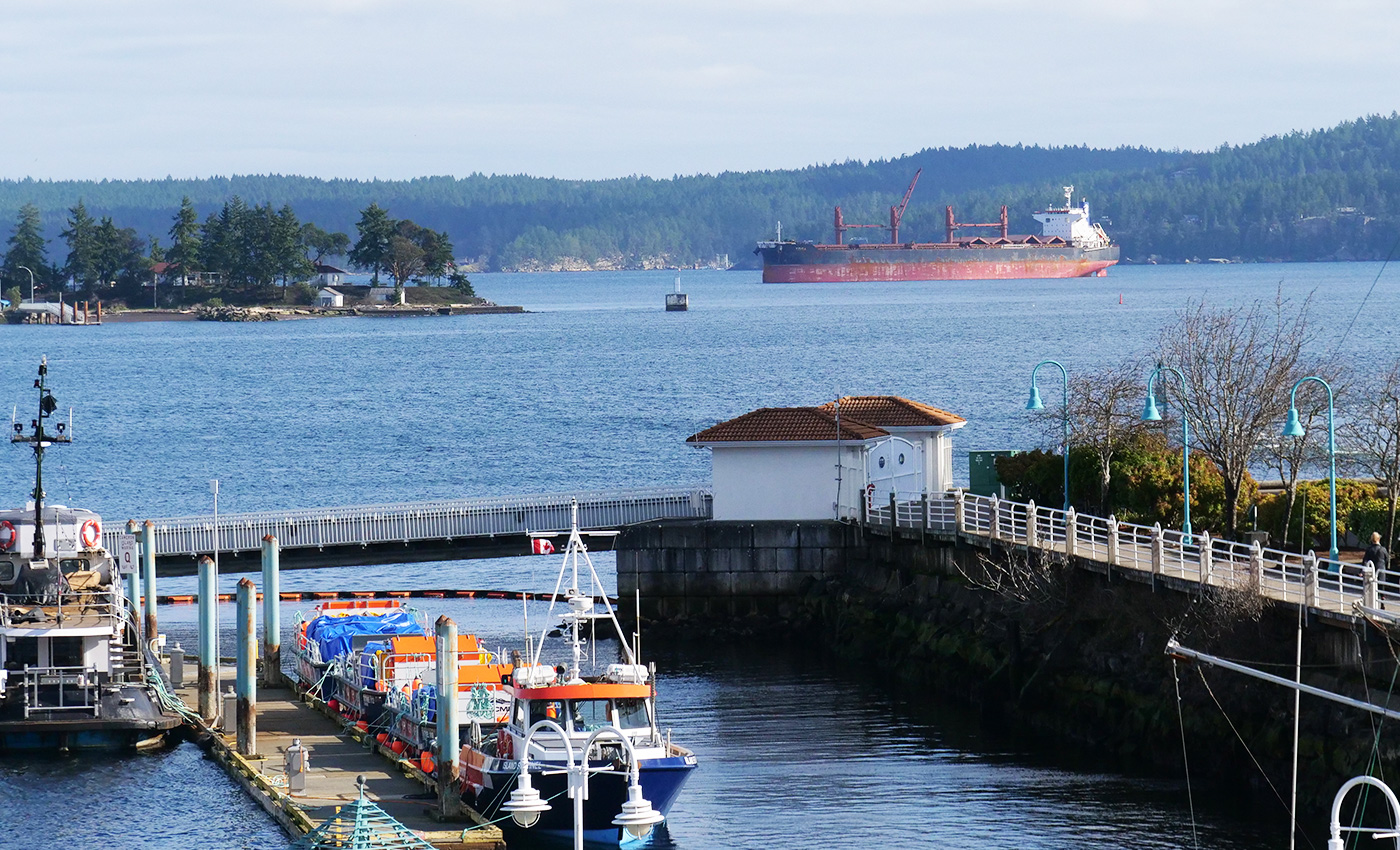 An empty freighter sits off the shores of Nanaimo