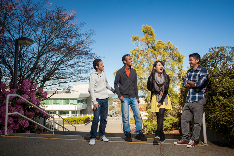 four students chatting on campus at Vancouver Island University