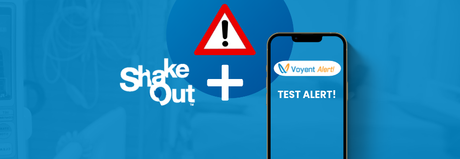 Smartphone displaying a Voyent Alert with 'TEST ALERT!' text next to a ShakeOut earthquake warning symbol on a blue background.