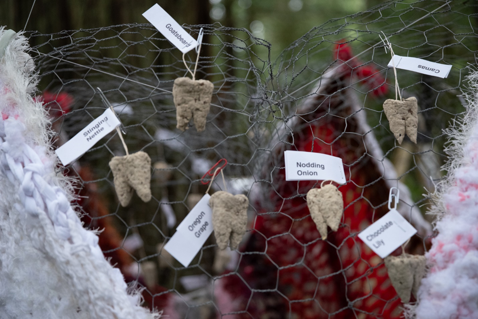 Fake teeth on chicken wire