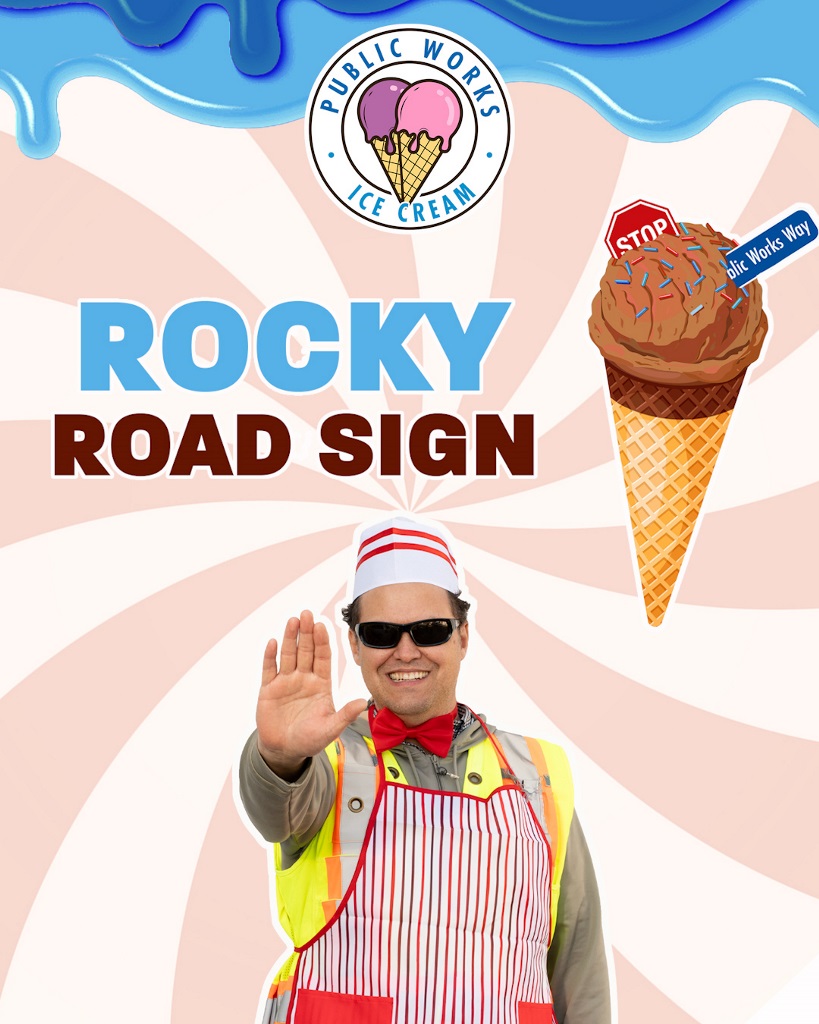 a public works employee is standing with his hand signaling stop. An ice cream cone is beside the text 'rocky road sign'