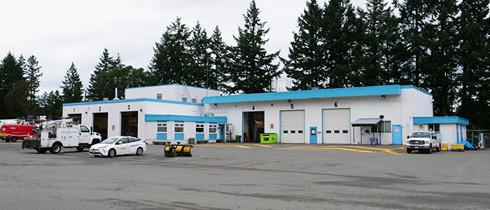 A wide shot showing the aging service bays at the Nanaimo Public Works yard