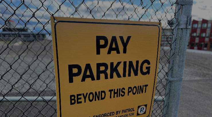 image of parking sign with link to pay your parking passes online