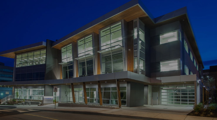 image of Nanaimo Services and Resource Centre at night with link to pay your business licence fees online