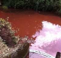 The Millstone River turned red from a chemical spill.
