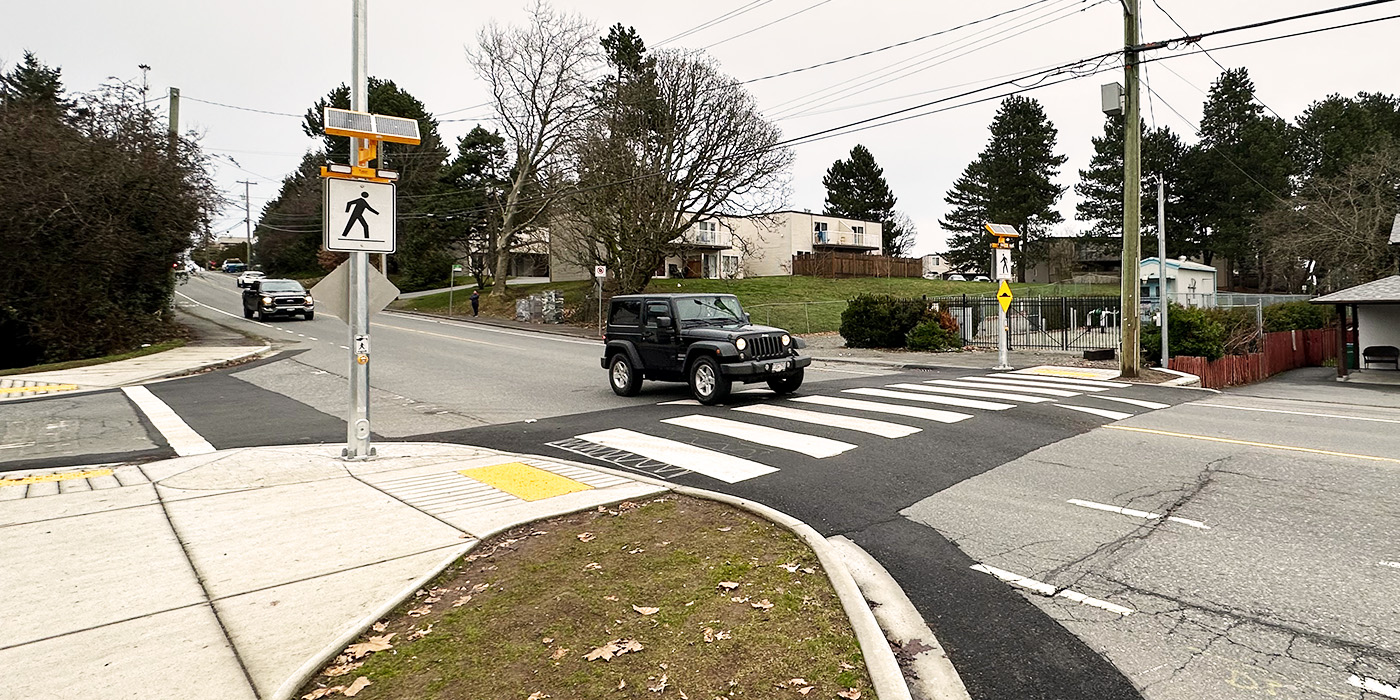 A Jeep goes over a new raised crosswalk at Bruce/Albion in Nanaimo.