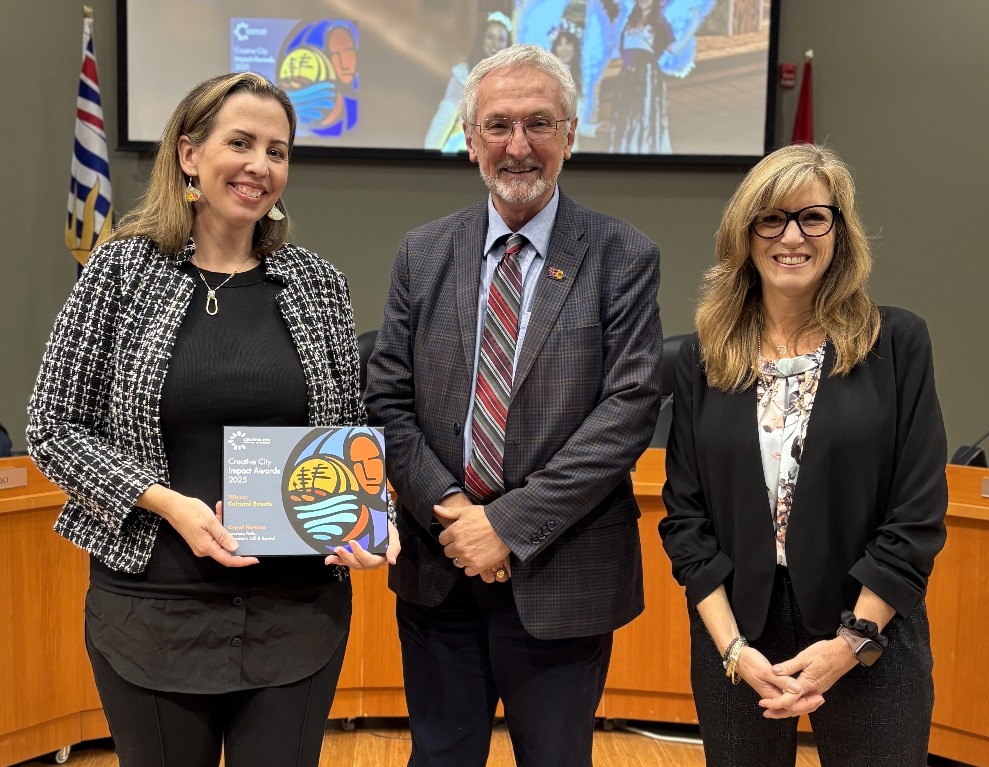 Mayor Krog presenting City staff with award