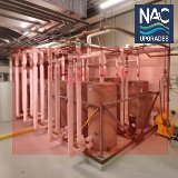 Mechanicalroomwithlargehotwaterstoragetankshighlightedforremovalaspartoftheproject